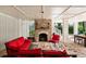 Inviting outdoor living area with a brick fireplace, comfortable seating, and an open layout at 2114 Pettigrew St, Sullivans Island, SC 29482