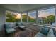 Inviting covered porch with comfortable seating and scenic views of the neighborhood at 2114 Pettigrew St, Sullivans Island, SC 29482