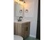 Bathroom featuring a vanity with a wood-look finish, matte black hardware, and modern lighting at 212 Blue Heron Dr, Summerville, SC 29485