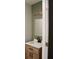 Bathroom featuring a modern vanity, framed mirror, and green tiled wall at 212 Blue Heron Dr, Summerville, SC 29485