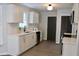Bright kitchen features white cabinets, modern appliances, and a view to the backyard at 212 Blue Heron Dr, Summerville, SC 29485