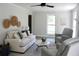 Bright living room featuring modern decor, neutral tones, and ample natural light at 212 Blue Heron Dr, Summerville, SC 29485