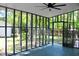 Spacious screened porch with a ceiling fan and a view of the backyard at 212 Blue Heron Dr, Summerville, SC 29485