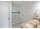 Bright bathroom featuring double sinks, granite countertops, tiled floors, and glass enclosed shower at 2308 Watchtower Ln, Charleston, SC 29414
