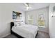 Bright bedroom featuring neutral walls, carpet, white ceiling fan, and natural light from large windows at 2308 Watchtower Ln, Charleston, SC 29414