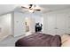Large bedroom featuring a bed, ceiling fan, carpet, closet, and entry to a bathroom and office at 2308 Watchtower Ln, Charleston, SC 29414