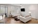 Inviting living room features hardwood floors, comfortable seating, and natural light from large windows at 2308 Watchtower Ln, Charleston, SC 29414