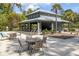 Community pool pavilion with lounge chairs and dining tables for relaxation at 2308 Watchtower Ln, Charleston, SC 29414
