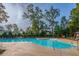 Large swimming pool with sun loungers and umbrellas at a community center at 2308 Watchtower Ln, Charleston, SC 29414