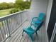 Balcony with views of the golf course featuring two colorful deck chairs and small table at 237 Driftwood Ln, Edisto Island, SC 29438