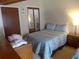 Bedroom featuring a queen bed, a single bed, and ample closet space at 237 Driftwood Ln, Edisto Island, SC 29438
