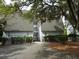 Rear exterior of the condo building, showcasing the parking area at 237 Driftwood Ln, Edisto Island, SC 29438