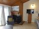 Comfortable living room with a fireplace and adjacent breakfast bar at 237 Driftwood Ln, Edisto Island, SC 29438