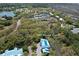 Aerial view of 2401 Racquet Club Dr featuring tennis courts, community clubhouse, and beautiful green landscaping at 2401 Racquet Club Dr, Seabrook Island, SC 29455