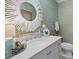 Elegant bathroom with a vanity, decorative mirror, and spa-like atmosphere at 2401 Racquet Club Dr, Seabrook Island, SC 29455