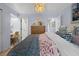 Bright bedroom with stylish decor including a cozy throw blanket, a writing desk and a door to an ensuite at 2401 Racquet Club Dr, Seabrook Island, SC 29455