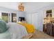 Bright bedroom with a decorative chandelier, private balcony, and a dedicated workstation for added convenience at 2401 Racquet Club Dr, Seabrook Island, SC 29455