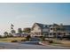 Beautiful coastal-style clubhouse with palm trees, American flags, and manicured landscaping at 2401 Racquet Club Dr, Seabrook Island, SC 29455