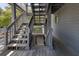 Exterior staircase with gray wooden steps and railings at 2401 Racquet Club Dr, Seabrook Island, SC 29455