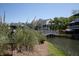 Exterior view of homes surrounding a lagoon and connected by a boardwalk at 2401 Racquet Club Dr, Seabrook Island, SC 29455