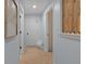 Hallway with white doors and light blue walls at 2401 Racquet Club Dr, Seabrook Island, SC 29455