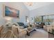 Open living room with a cozy seating area, fireplace, and access to the outdoors at 2401 Racquet Club Dr, Seabrook Island, SC 29455