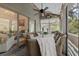 Screened porch with comfortable seating and views of the property's exterior at 2401 Racquet Club Dr, Seabrook Island, SC 29455