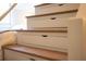 Staircase with oak treads and built-in storage drawers at 2401 Racquet Club Dr, Seabrook Island, SC 29455