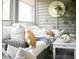 Relaxing sunroom featuring a comfortable seating area with stylish pillows and decorative accents at 2401 Racquet Club Dr, Seabrook Island, SC 29455