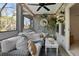 Cozy sunroom with comfortable seating, stylish decor, and views of lush greenery, perfect for relaxation at 2401 Racquet Club Dr, Seabrook Island, SC 29455