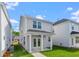 Backyard patio with green grass, privacy fence, and a covered patio, perfect for outdoor living at 308 O'Malley Dr, Summerville, SC 29483