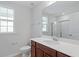 Bathroom featuring a vanity with a solid surface countertop, modern fixtures, and framed mirror at 308 O'Malley Dr, Summerville, SC 29483