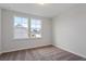 Neutral bedroom with natural light from two windows and plush carpeting at 308 O'Malley Dr, Summerville, SC 29483
