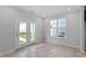 Bright dining area with double doors to backyard and a large window, providing plenty of natural light at 308 O'Malley Dr, Summerville, SC 29483