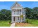 Charming two-story home featuring a covered porch, balcony, and well-maintained landscaping at 308 O'Malley Dr, Summerville, SC 29483