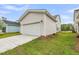Detached one car garage with white door and siding and concrete driveway at 308 O'Malley Dr, Summerville, SC 29483