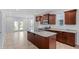Open kitchen featuring granite countertops, stainless steel appliances, and dark wood cabinets at 308 O'Malley Dr, Summerville, SC 29483