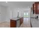 Modern kitchen boasts granite countertops, a central island, and stainless steel appliances at 308 O'Malley Dr, Summerville, SC 29483