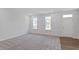 The living room features plush carpeting, natural light, and modern finishes at 308 O'Malley Dr, Summerville, SC 29483