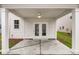Covered patio features a ceiling fan and access to the home through glass French doors at 308 O'Malley Dr, Summerville, SC 29483
