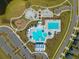 An aerial view captures the community's diverse pool facilities, playground, parking, and surrounding houses at 314 Bear Paw Ln, Summerville, SC 29486