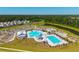 Aerial view of the community pool highlighting the water park area, lap pool, and various amenities within a residential area at 314 Bear Paw Ln, Summerville, SC 29486