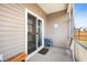 Enclosed back porch featuring outdoor seating and an exterior view of the fenced yard at 314 Bear Paw Ln, Summerville, SC 29486