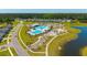 An aerial view of a neighborhood pool with lap lanes, leisure areas, and surrounding recreational facilities at 314 Bear Paw Ln, Summerville, SC 29486