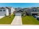 New home featuring the driveway, front yard, and garage, with well-manicured landscaping at 314 Bear Paw Ln, Summerville, SC 29486