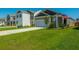 New home displaying the driveway, front yard, and garage in a well-maintained landscape at 314 Bear Paw Ln, Summerville, SC 29486