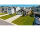 New home showing the driveway, front yard, and garage with a manicured lawn at 314 Bear Paw Ln, Summerville, SC 29486