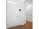 Bright entryway featuring a white door with modern hardware and smart home features at 314 Bear Paw Ln, Summerville, SC 29486