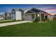 Charming single-Gathering home featuring a well-manicured lawn and an attached two-car garage at 314 Bear Paw Ln, Summerville, SC 29486