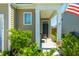 Welcoming front porch with a comfortable chair and well manicured landscaping at 314 Bear Paw Ln, Summerville, SC 29486